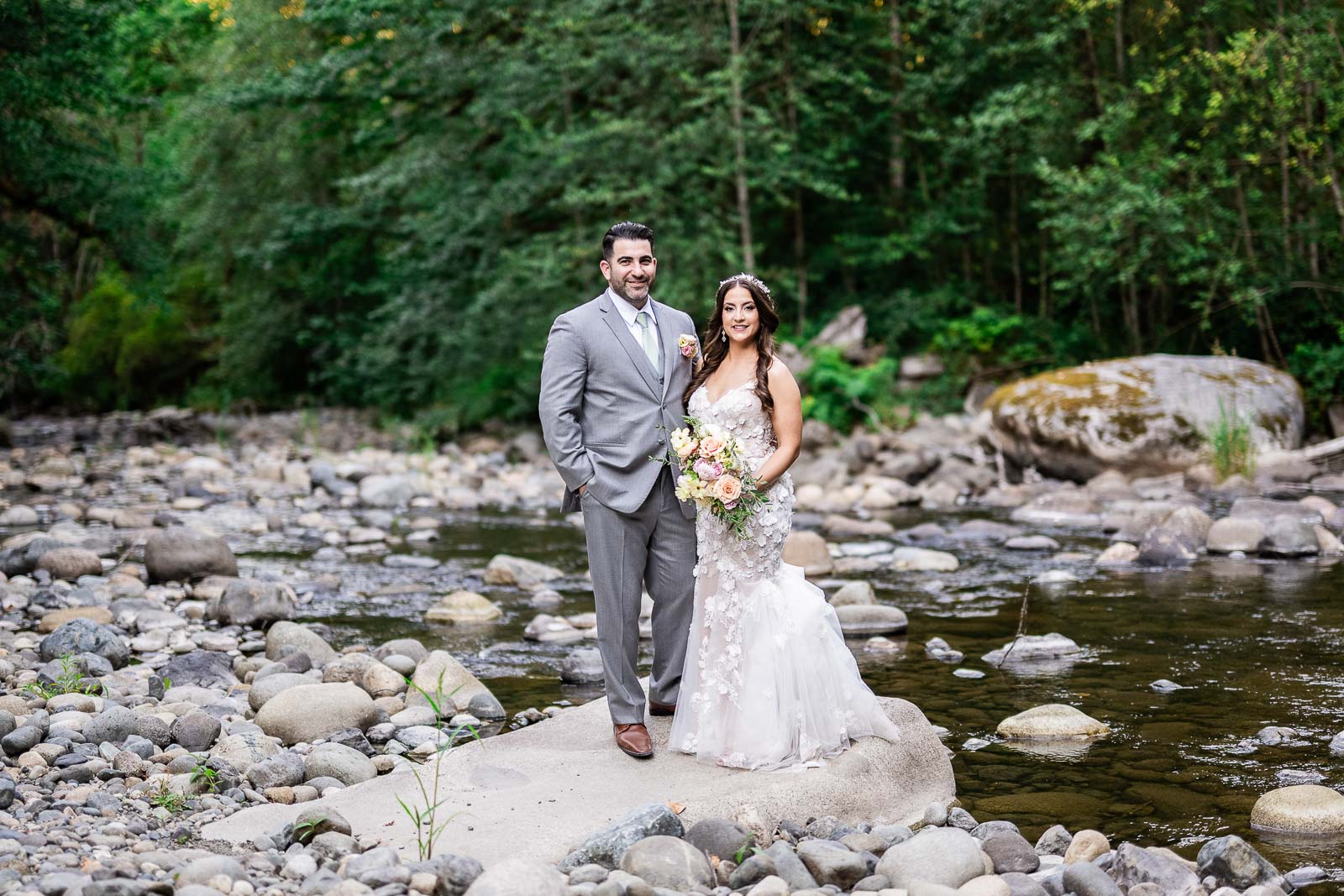 couple poses for Washington Wedding Photographer at tree house point