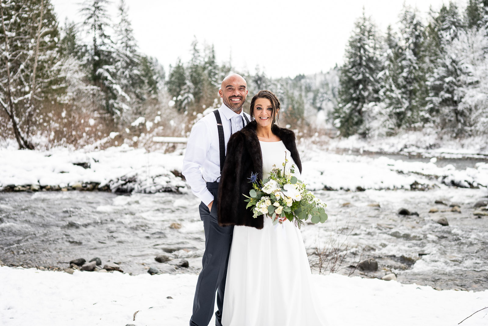 couple poses for washington elopement photographer during winter elopement