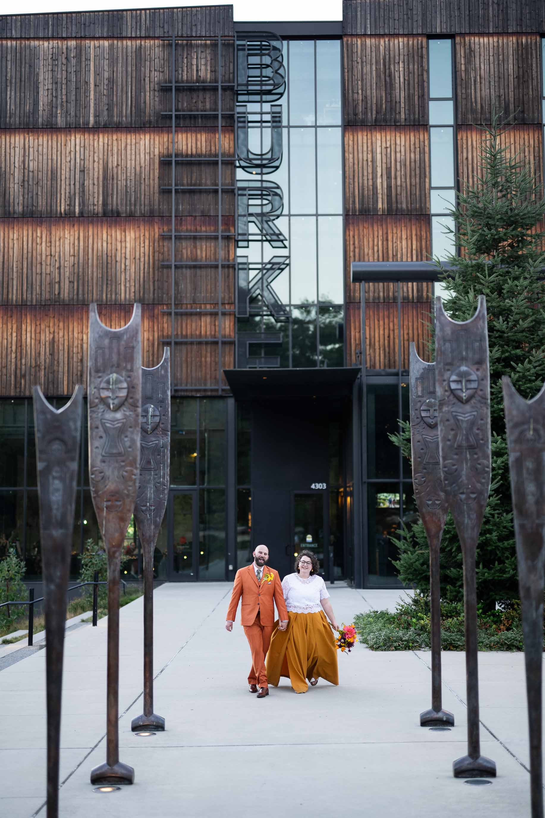 couple poses for seattle wedding photographer at Burke Museum