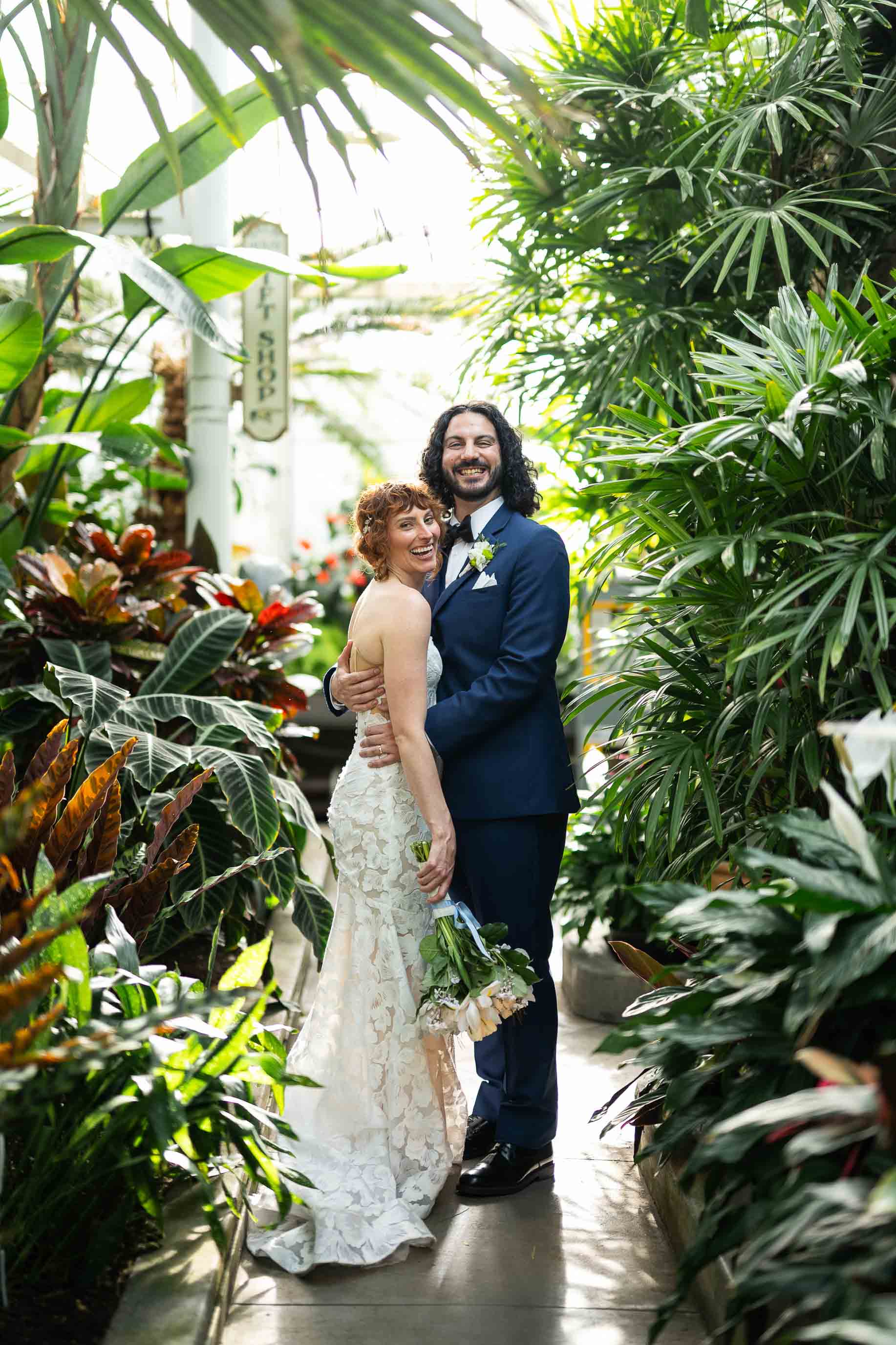bride and groom pose in volunteer park