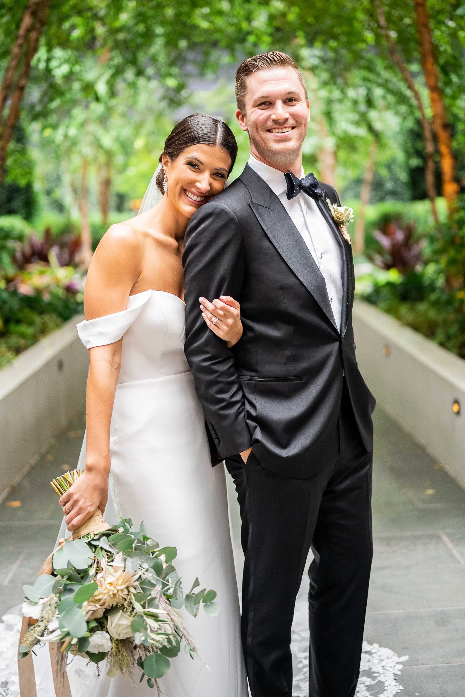 bride and groom pose for photo in washington on wedding day