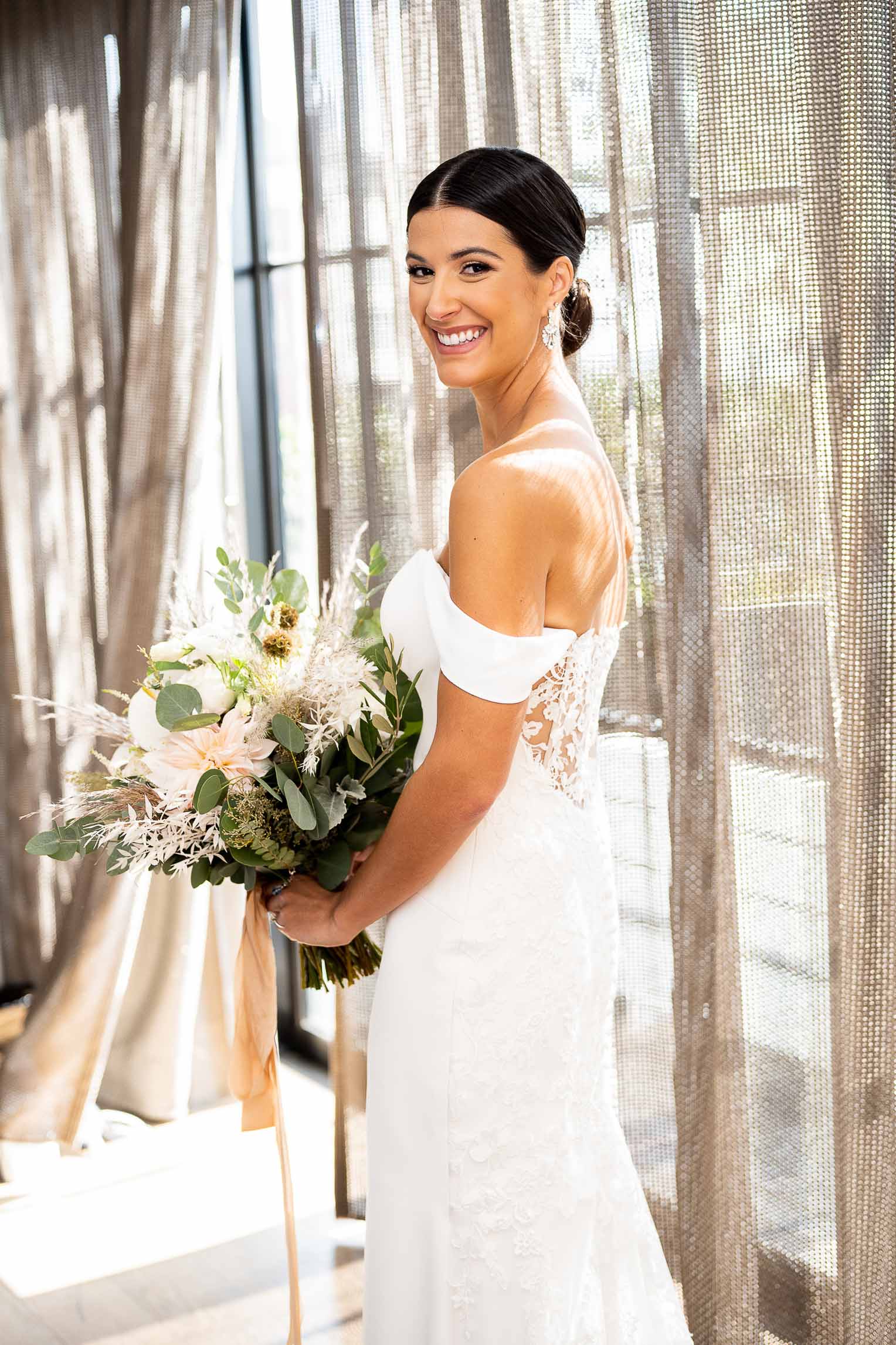 bride getting ready in front of window in seattle washington